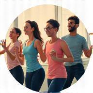 Group of office workers exercising together.